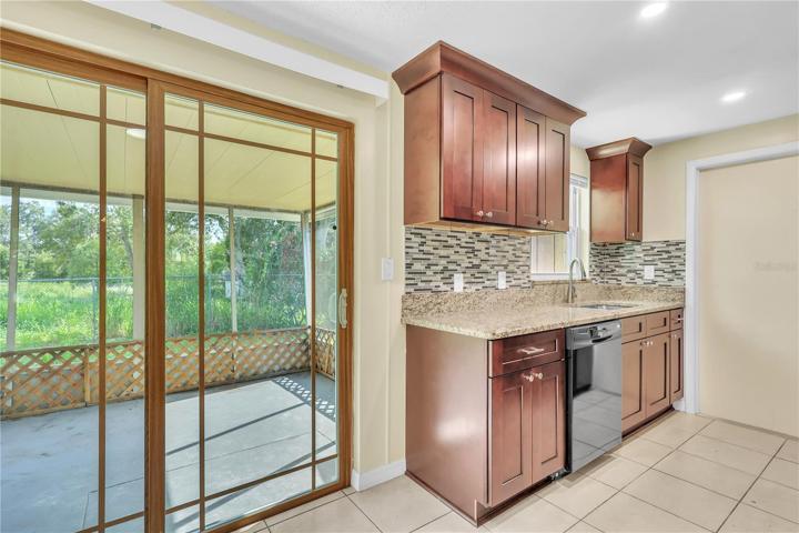 New Sliding door leading to enclosed screen patio!