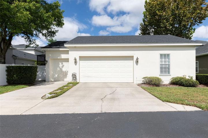 3-Car Garage with Full Driveway and floored attic storage.