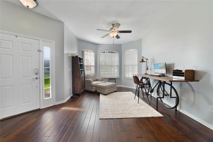 There are TILE and WOOD FLOORS throughout making maintenance a breeze, starting in your formal living and dining rooms, flexible to use as family space or entertain with ease!