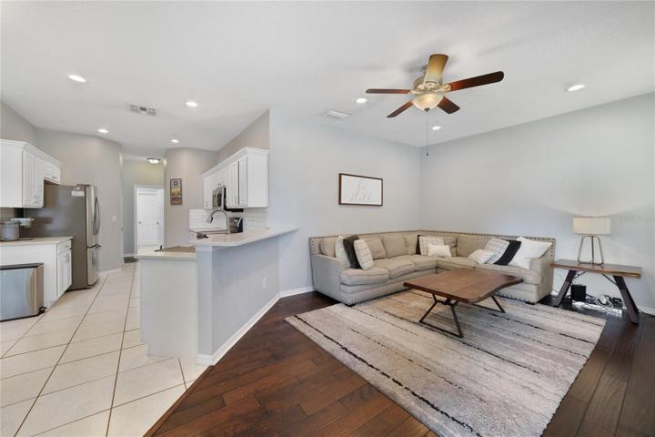 The kitchen is open to a generous family room with access to the COVERED PAVER LANAI!