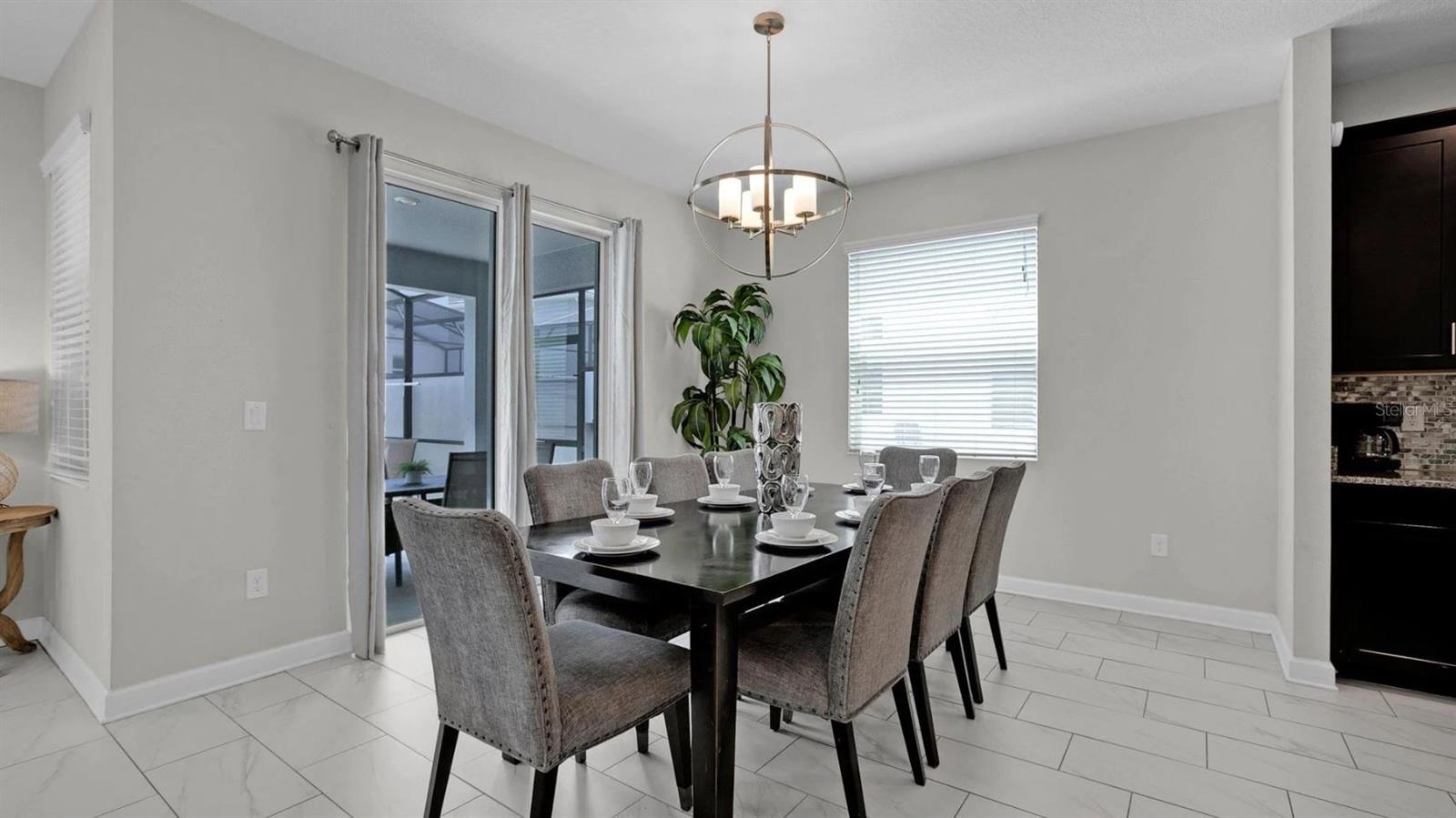 The dining area has its own access to the lanai and is open to a modern kitchen!