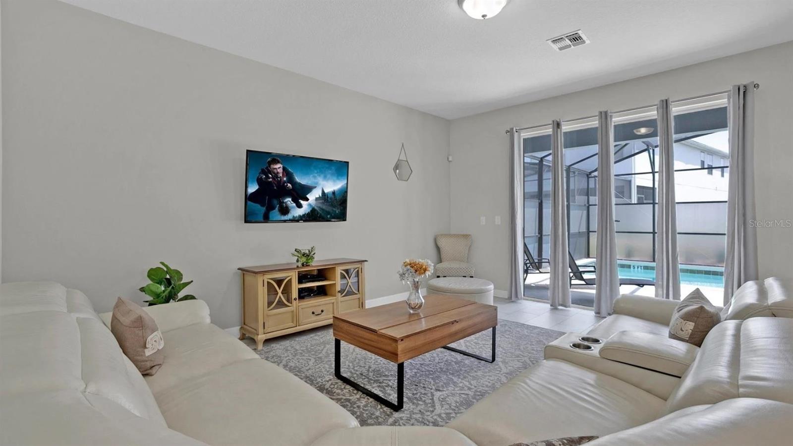 Your living area features an OVERSIZED SLIDING GLASS DOOR for access to the lanai and pool and great NATURAL LIGHT!