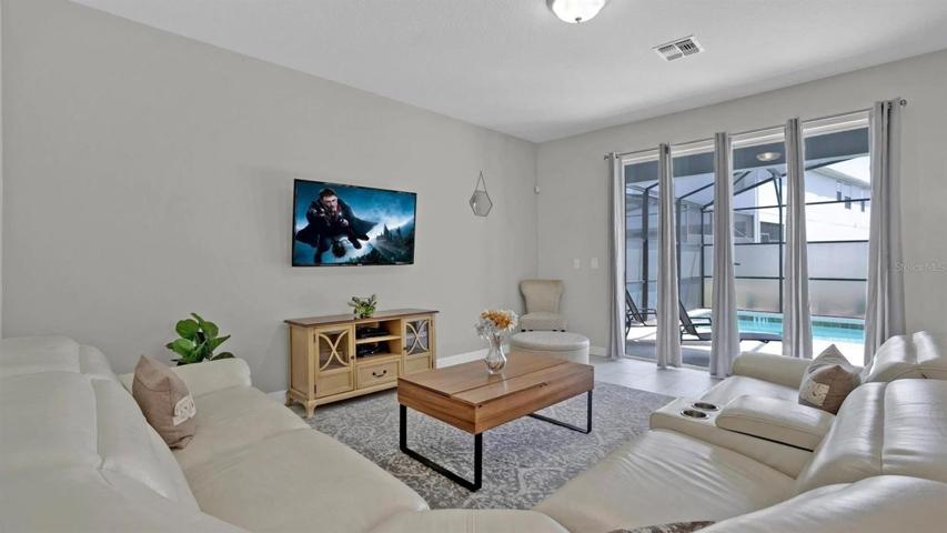Your living area features an OVERSIZED SLIDING GLASS DOOR for access to the lanai and pool and great NATURAL LIGHT!