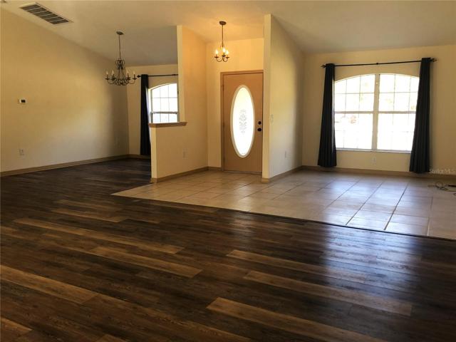 GREAT ROOM FROM FRONLANAI DOOR LOOKING THRU LIVING &FAMILY  ROOM TO