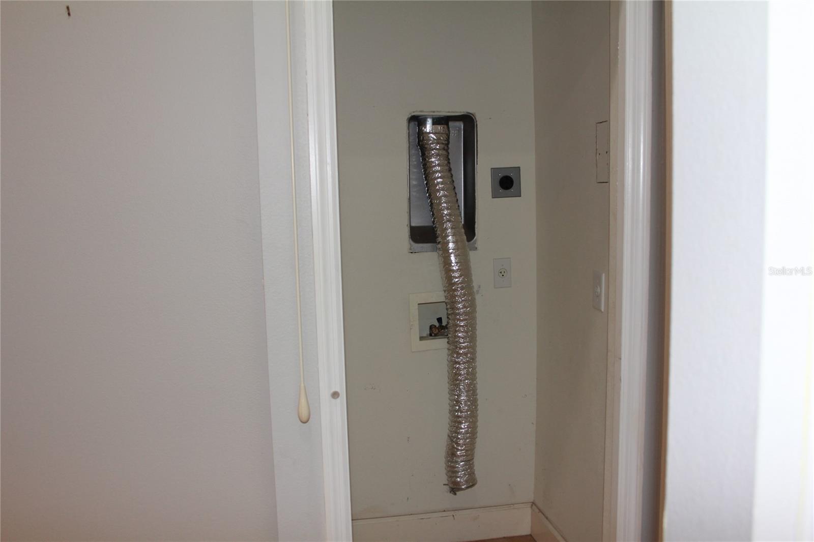 Laundry closet in kitchen