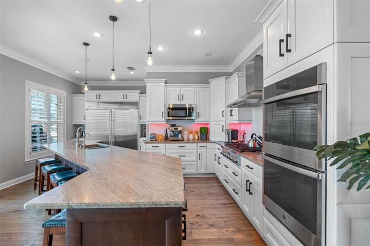 Large granite island with leather finish.