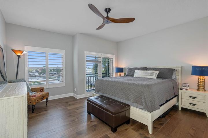 Guest bedroom with sliders to the balcony.
