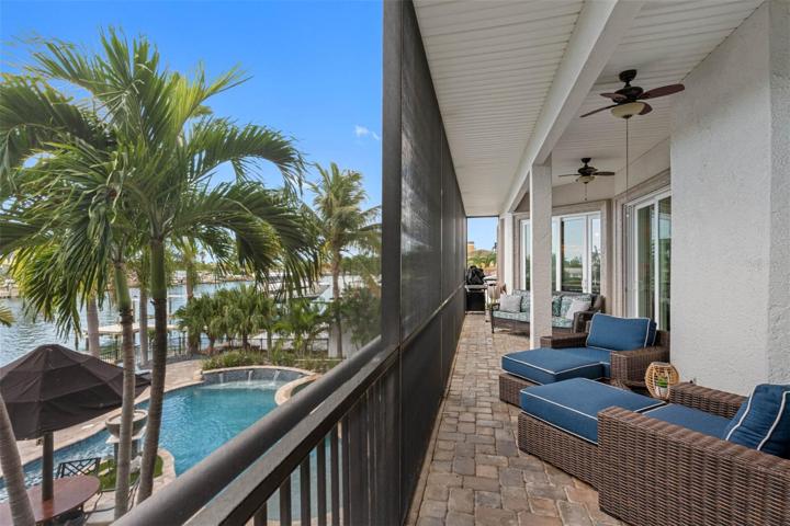 Screened balcony is the entire width of the home.