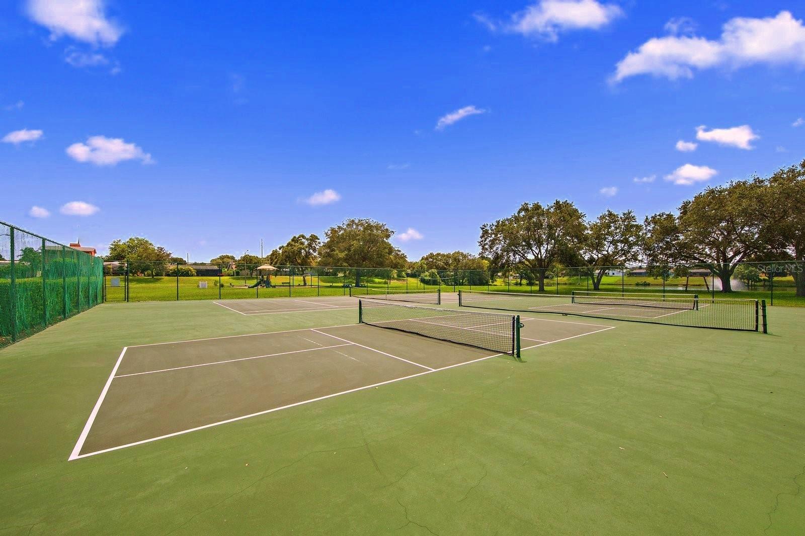 These courts are used for tennis and pickleball play~