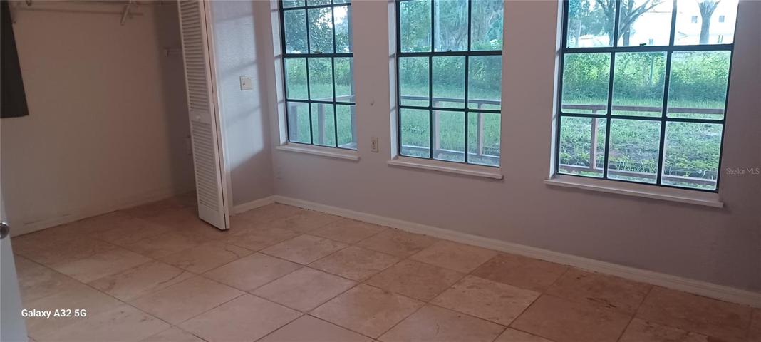 2nd bedroom with travertine floor