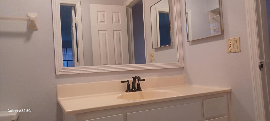 vanity with beautiful mirror an medicine cabinet