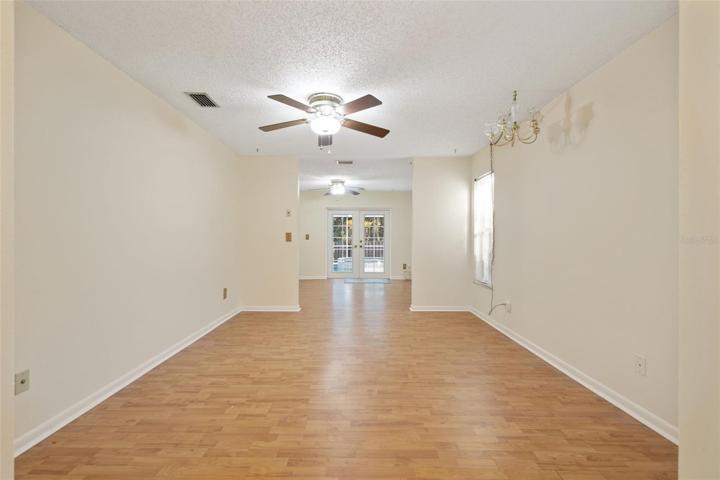 The primary suite with private access to the pool and backyard