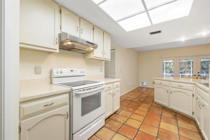 Beautiful tile and a large kitchen with plenty of imagination for potential updates