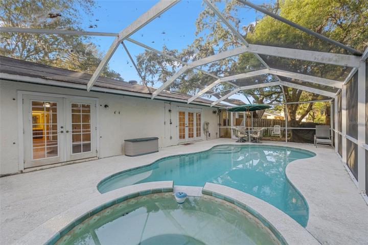 Enjoy the luxury of your own private screened-in pool and hot tub