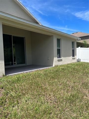 Rear of home view of covered lanai/patio