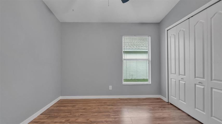 Secondary bedroom with large closet - vaulted ceiling