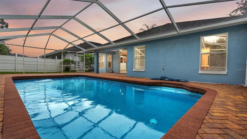 In-ground pool with pavers, screened in with plenty of privacy