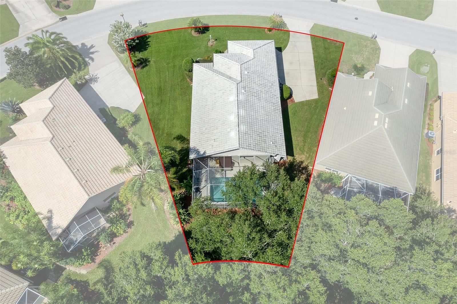 Aerial view of this oversized lot with mature trees in the back that help provide privacy.