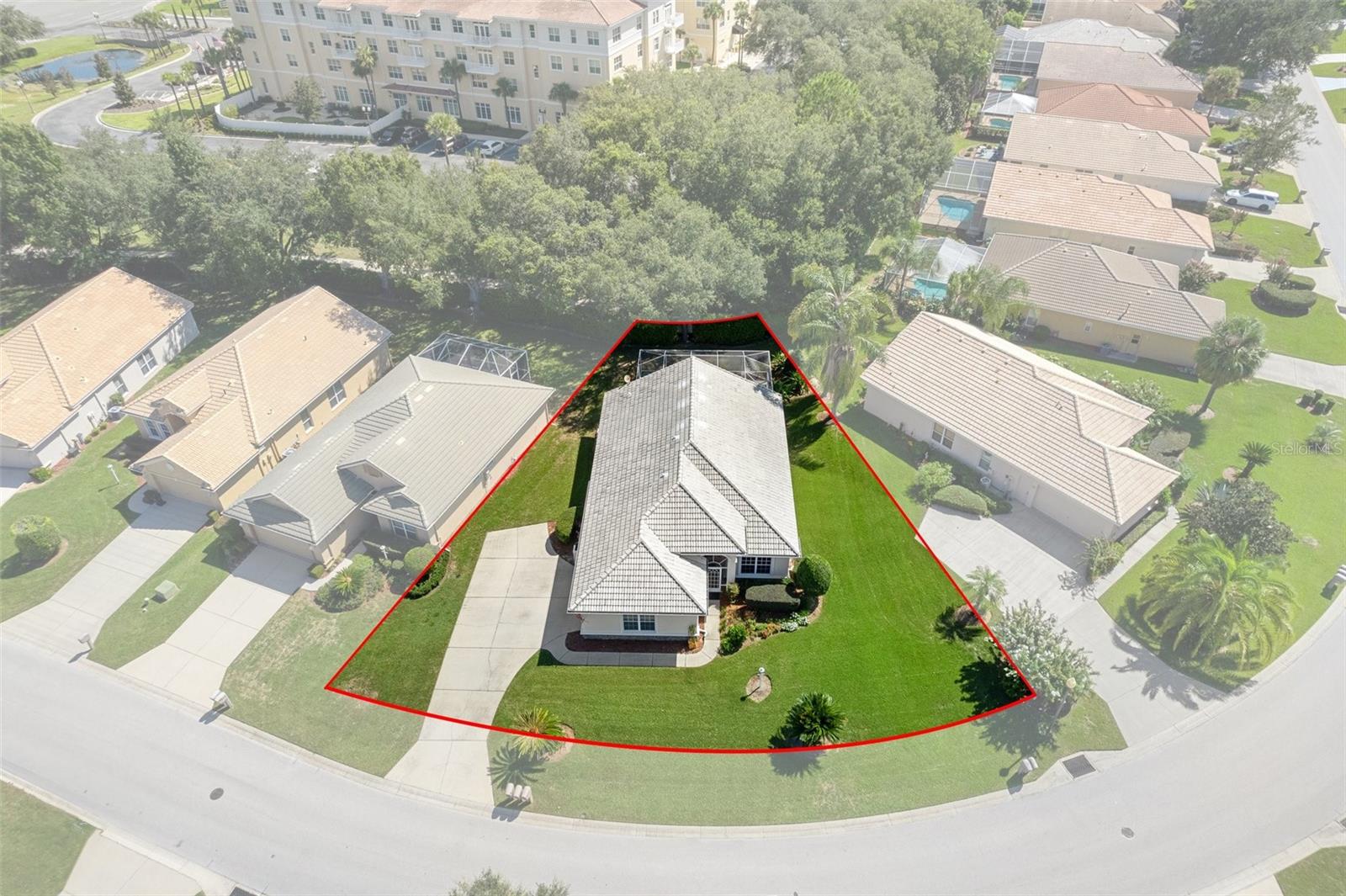 The oversized home site allows for better privacy between homes in this carefree neighborhood. The building behind the property is the 5 star Assisted Living Facility Grand Living and makes for a great neighbor. At ground level it is well blocked from view in the back by the large oak trees.