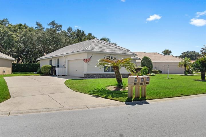 Desirable sideload garage with long driveway and turn-around/parking pad.