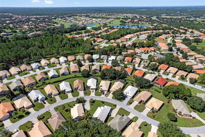 An aerial view of a large portion of the west side Terra Vista. This featured home is in the foreground, with the white tile roof in the center of the picture.