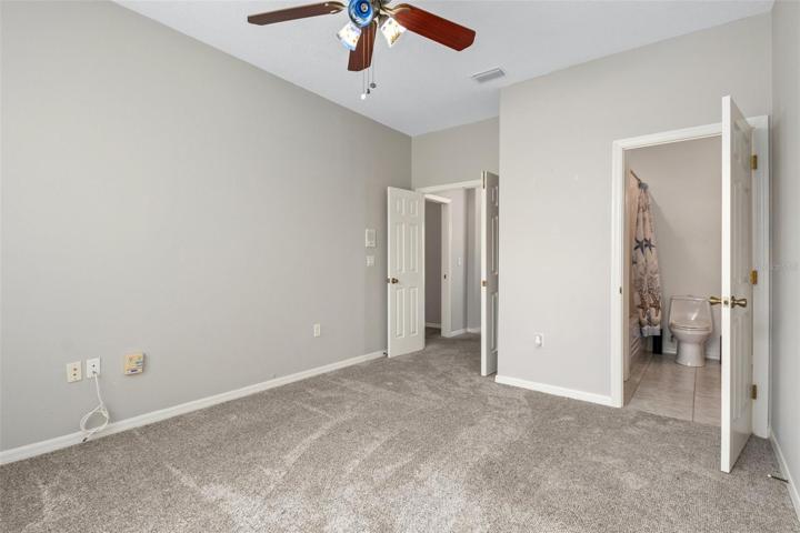 Opposite view looking from window across to French Door entry. The doorway on the right is to the Jack and Jill bath that is shared with the front guest bedroom.