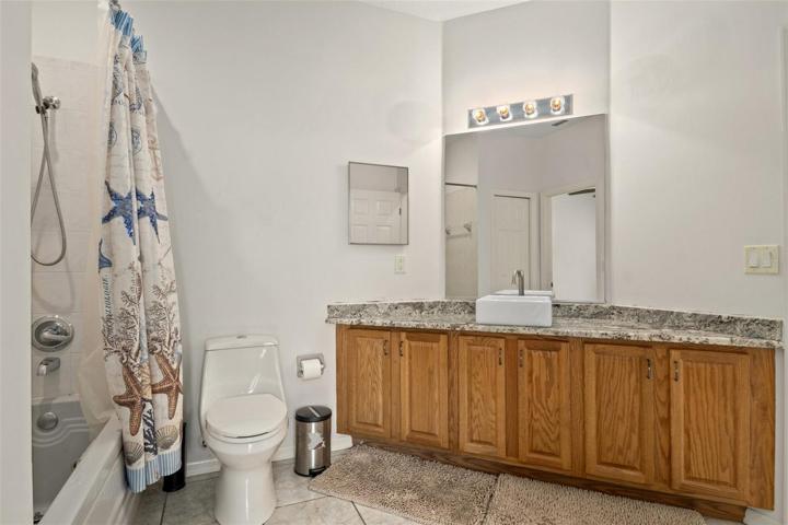 The Jack and Jill bath features a large vanity for extra storage and plenty of counter space on the recently added granite countertops.