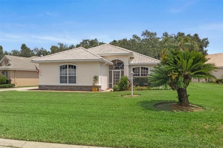 This home is perfectly positioned on this oversized lot.  The nice plush lawn adds to the curb appeal.