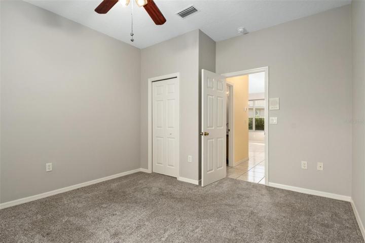 View from corner of bedroom looking back toward bedroom door. The opening just outside bedroom to the left is to the Jack and Jill Guest Bath. Opposite the bedroom door is the dining area.