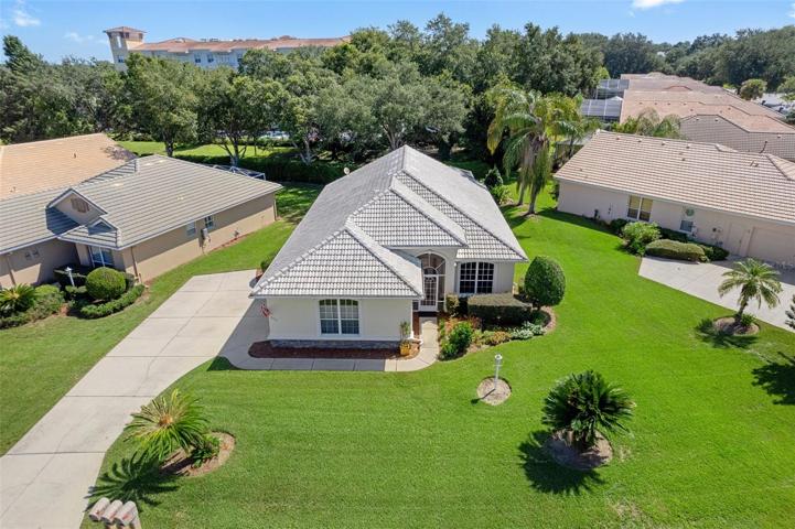 Welcome to 903 W Skyview Crossing Dr Hernando, FL 34442. This view gives you a great look at the long convenient driveway that ends with the turn-around parking pad.