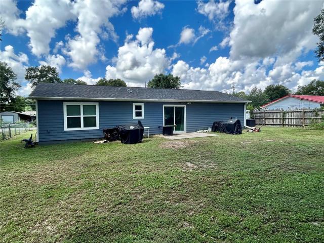 Rear view of home and backyard