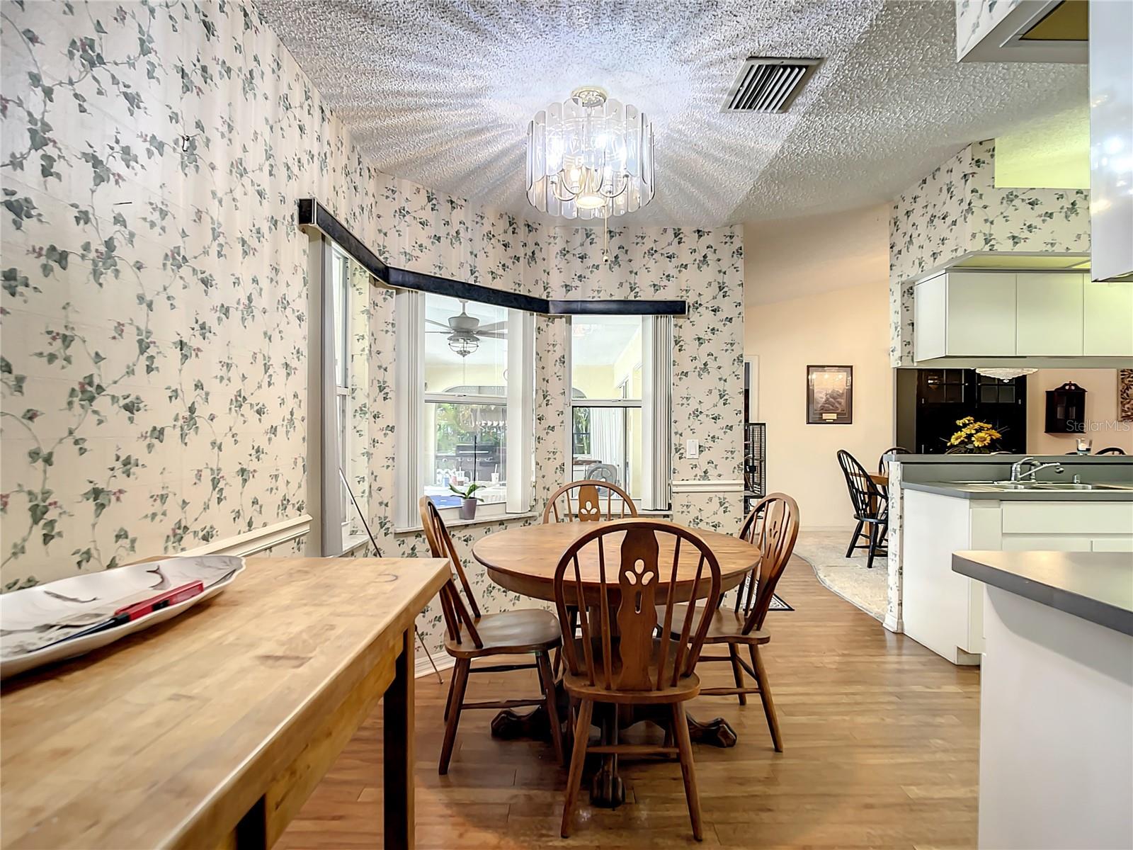 Eat in kitchen area overlooks pool lanai.