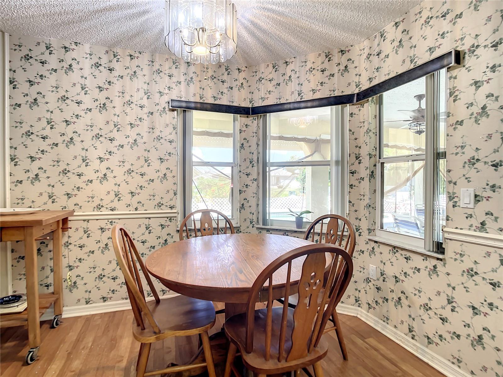 Eat in kitchen area with bay windows overlooking lanai.