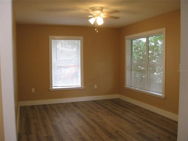 LIVING ROOM - FRONT ENTRY DOOR IN CORNER ON RIGHT.