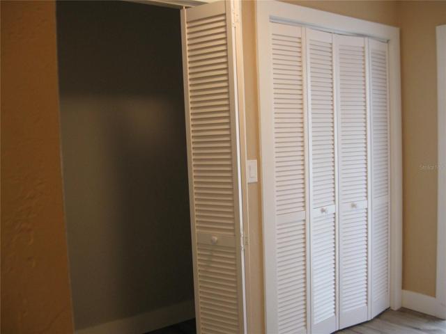 ANOTHER VIEW OF HALLWAY CLOSETS.