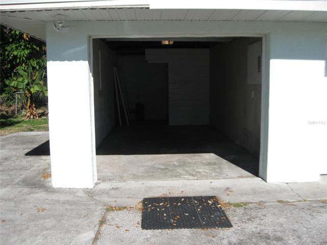 ONE CAR GARAGE AND ON OTHER SIDE OF BLDG. IS LAUNDRY HOOK-UPS.