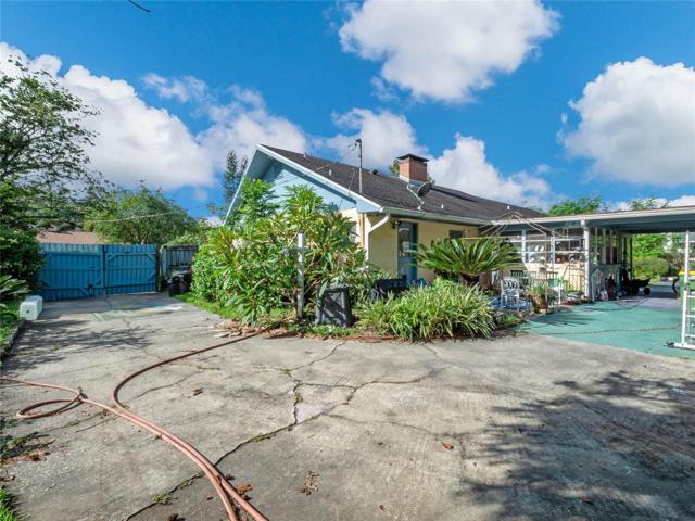 View of wrap around driveway and Florida room.