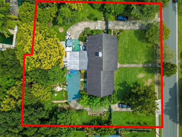 Aerial of lot and wrap around driveway.