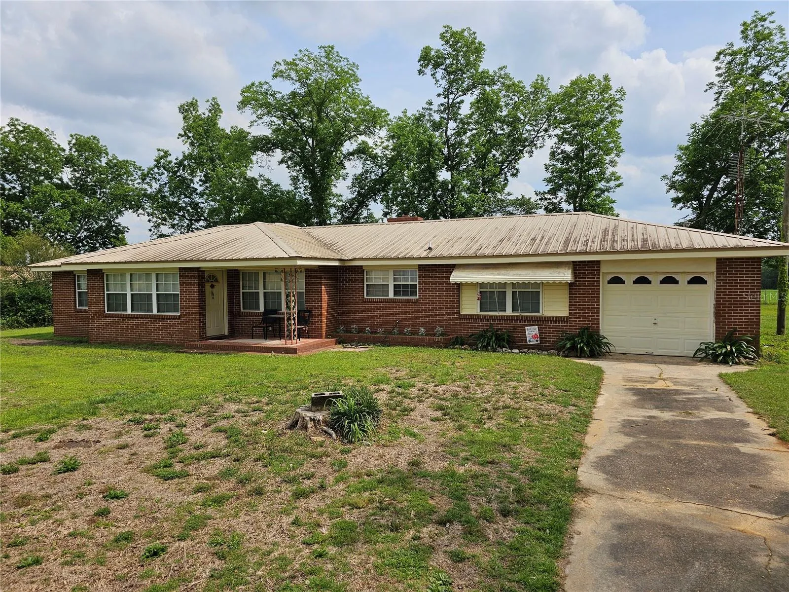 Welcome home to your brick 3 bedroom 2 bath home with a single car garage.  This property is located on 40 acres in Graceville, Florida.