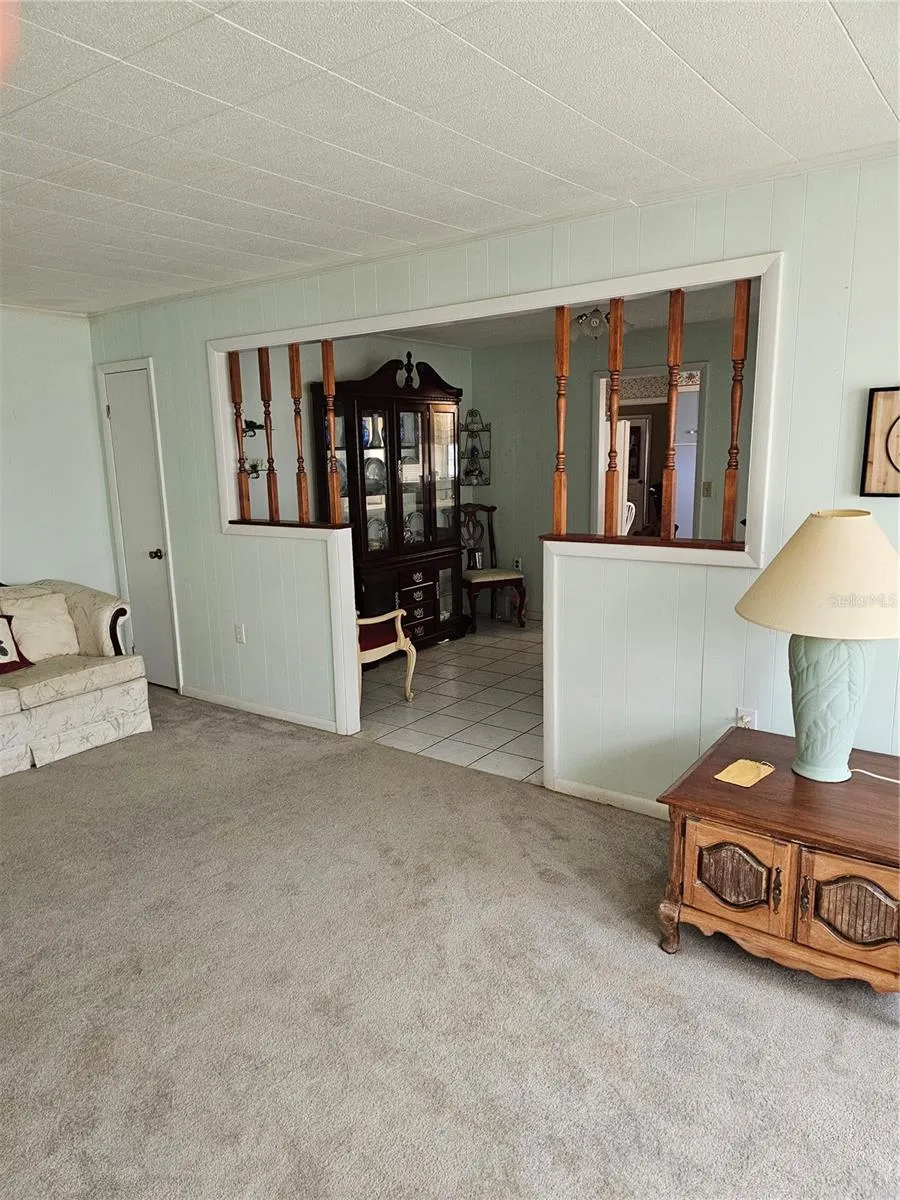 Living room with view of dining room