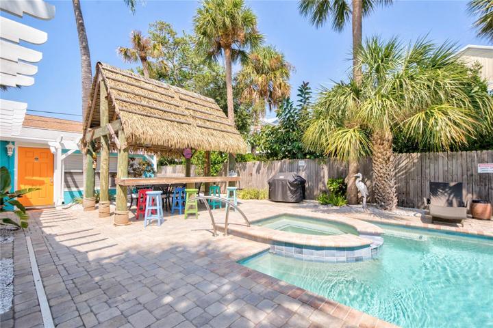 Tiki bar and pool/spa accessible by all 4 cottages