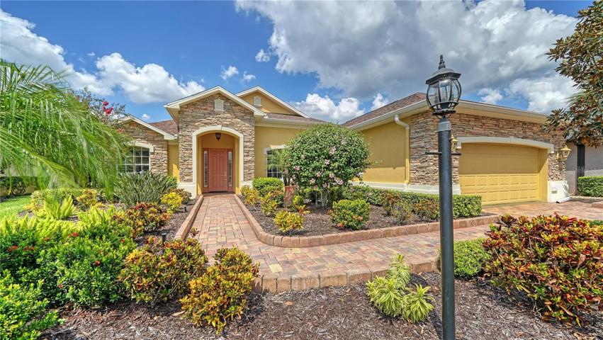 Gorgeous Tuscan Inspired Exterior with Stone and Paver details'