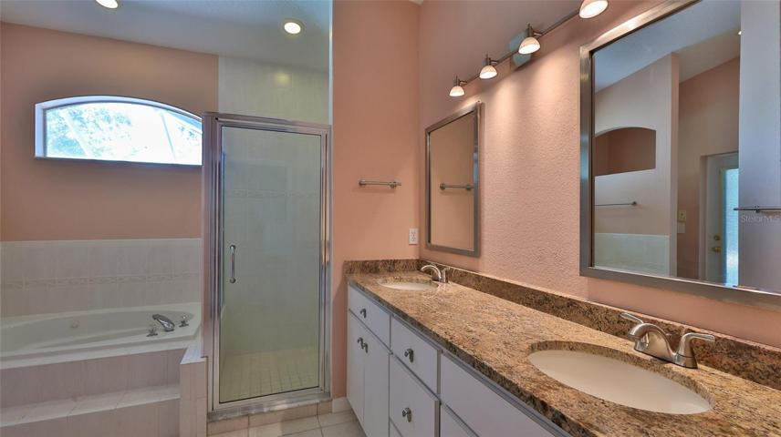 Owner's bath includes dual sinks.