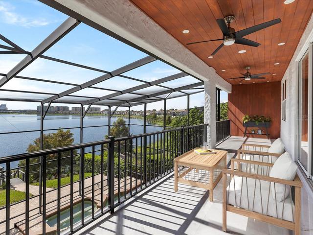 Your private balcony overlooks the pool and has sweeping lake views! Virtually Staged.