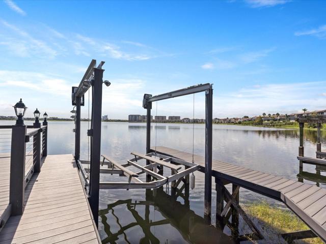 Work your way down to the NEW BOAT LIFT and DOCK, stopping along the way to admire the new PAVER PATIO and RETAINING WALL, grill area and of course the OUT OF THIS WORLD VIEW!