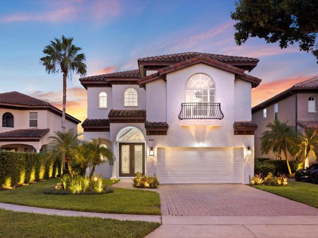 Welcome to Mirabella at Vizcaya, an exclusive GUARD GATED community of just 60 luxury homes, and this stunning LAKEFRONT POOL HOME on a half acre lot, COMPLETELY RENOVATED with impeccable detail and unparalleled views of Little Sand Lake and the iconic ORLANDO EYE!