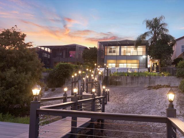 Zoned for A-RATED Bay Meadows Elementary this gated community is the epitome of luxury with a 24-HOUR GUARD and convenient access to surrounding lakes, shopping and you are just steps from Dr. Phillips’ RESTAURANT ROW!