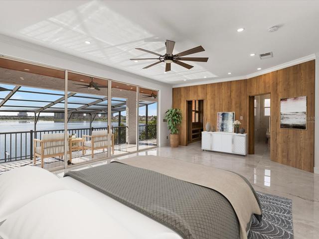 An indulgent OWNER’S SUITE awaits featuring a screened BALCONY overlooking the pool and tranquil expanse of Little Sand Lake through another wall of sliding glass door! Virtually Staged.