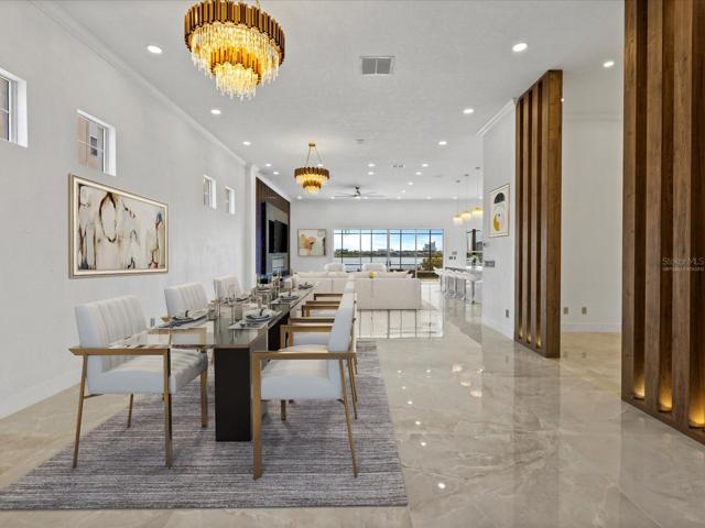Every fixture in this home has been updated and you will find CUSTOM CHANDELIERS in many of the rooms! Virtually Staged.