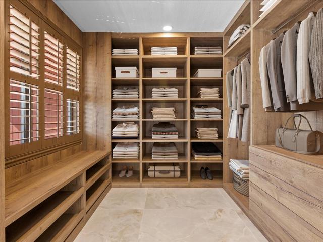 Custom walk-in closet! Virtually Staged.